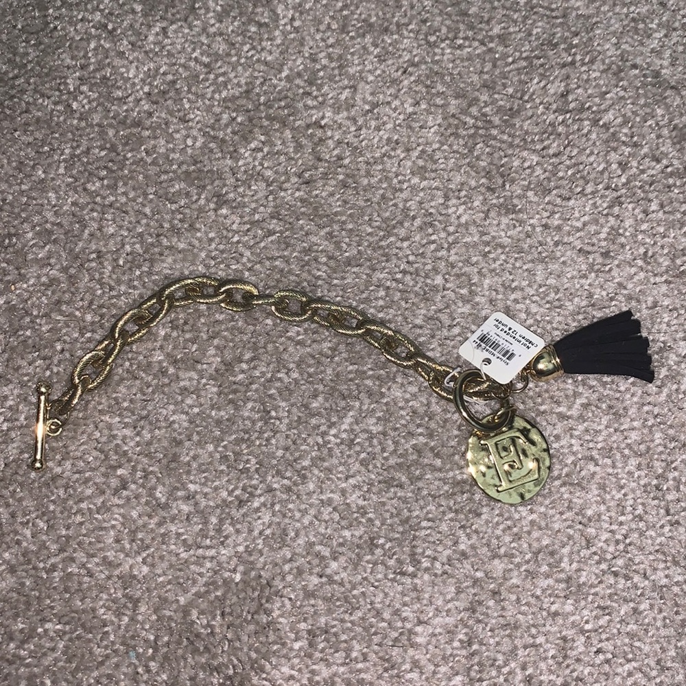 Gold plated monogrammed bracelet with tassel detail